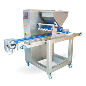 Dosificadora acoplada a una línea de producción para hacer plancha de bizcocho MAS